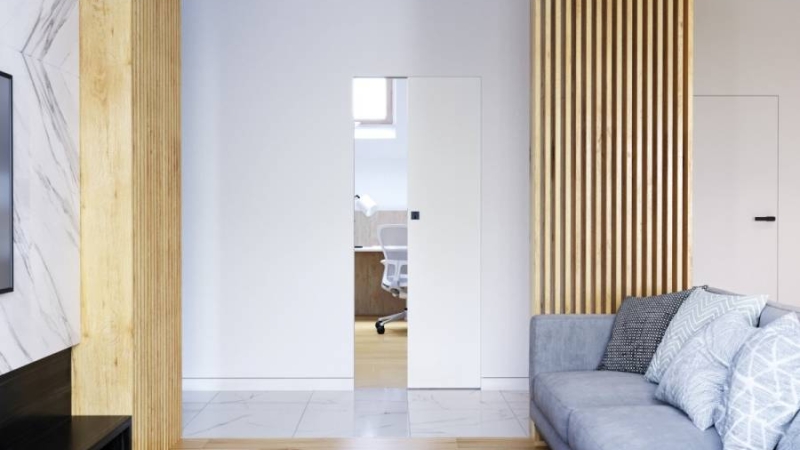 Drzwi ukryte w ścianie – elegancja i funkcjonalność w T