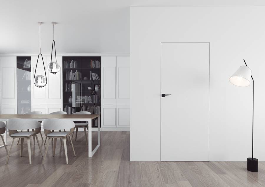 białe drzwi ukryte w otwartej kuchni z jadalnią