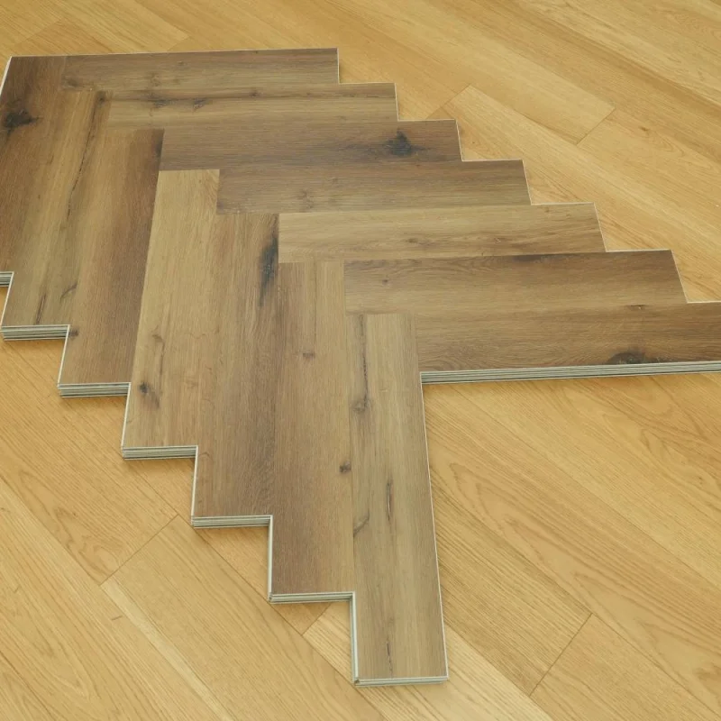 Panele winylowe SPC ze zintegrowanym podkładem Jodełka Del